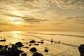 Beautiful sunset on the beach. Seascape at sunset. An impressive golden sky