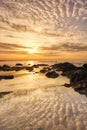 Beautiful sunset on the beach. Seascape at the sunrise. An impressive golden sky