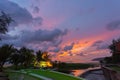 Beautiful sunset behind the great Naga statue in Karon beach Royalty Free Stock Photo