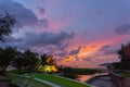 Beautiful sunset behind the great Naga statue in Karon beach Royalty Free Stock Photo