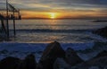 Beautiful Sunset and Big Waves by a Jetty at the Redondo Beach Pier, South Bay of Los Angeles County, California