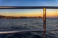Beautiful sunset of the city of Cape Saint Luke from a catamaran sailing in the Gulf of California.
