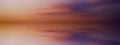Beautiful sunset in the clouds over the sea. Red orange blue purple abstract background. Day and night. Royalty Free Stock Photo