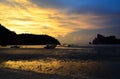 Beautiful sunset with clouds over a shallow beach Royalty Free Stock Photo