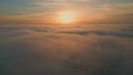 Beautiful sunset cloudy sky aerial view. Golden sun shining over fluffy clouds Royalty Free Stock Photo