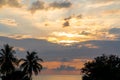 Beautiful sunset cloudy sky on the sea with silhouette trees. Morning sunrise on the beach of Desaru Coast, Malaysia Royalty Free Stock Photo