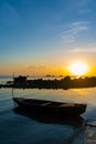 Beautiful sunset on the coast of a tropical island in Thailand, a silhouette of a boat in the ocean