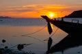 Beautiful sunset on the coast of a tropical island in Thailand, a silhouette of a boat in the ocean