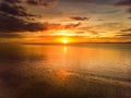 Beautiful sunset colors over the coastline of Allerdale district in Cumbria, UK. Sun setting over the shore of Allonby bay on Royalty Free Stock Photo