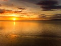 Beautiful sunset colors over the coastline of Allerdale district in Cumbria, UK. Sun setting over the shore of Allonby bay on Royalty Free Stock Photo