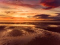 Beautiful sunset colors over the coastline of Allerdale district in Cumbria, UK. Sun setting over the shore of Allonby bay on Royalty Free Stock Photo