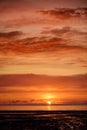 Beautiful sunset colors over the coastline of Allerdale district in Cumbria, UK. Sun setting over the shore of Allonby bay on Royalty Free Stock Photo