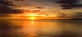 Beautiful sunset colors over the coastline of Allerdale district in Cumbria, UK. Sun setting over the shore of Allonby bay on Royalty Free Stock Photo