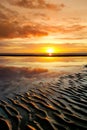 Beautiful sunset colors over the coastline of Allerdale district in Cumbria, UK. Sun setting over the shore of Allonby bay on Royalty Free Stock Photo