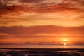 Beautiful sunset colors over the coastline of Allerdale district in Cumbria, UK. Sun setting over the shore of Allonby bay on Royalty Free Stock Photo