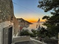 Beautiful sunset colors from the picturesque Hydra island in Greece. View from hydra town over the port