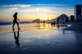 Beautiful sunset on Copacabana beach with silhouettes of people, Rio de Janeiro, Brazil Royalty Free Stock Photo