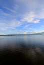 Beautiful sunset and evening sky with mountain and clouds and sunset reflected in the lake for background. Countryside Landscape Royalty Free Stock Photo