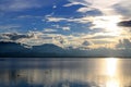 Beautiful sunset and evening sky with mountain and clouds and sunset reflected in the lake for background. Countryside Landscape U Royalty Free Stock Photo