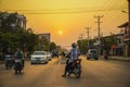 Mandalay, Myanmar - March 26, 2017: Beautiful sunset and evening traffic on the roads of Mandalay