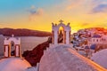 Beautiful sunset with famous Orthodox church on Santorini island, Aegean sea, Greece Royalty Free Stock Photo