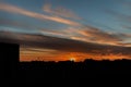 Beautiful sunset with feathery clouds on the sky. Spring evening