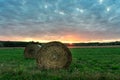 Beautiful sunset on the field in ÃÂrsÃÂ©g Hungary with sunbeams and bales Royalty Free Stock Photo