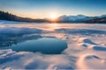 Beautiful sunset, a frozen lake and snow-capped mountains. Royalty Free Stock Photo