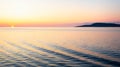 Beautiful sunset and gently lapping waves viewed from the deck of a Cruise Ship