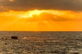 Beautiful sunset and golden twilight, and clouds and a longly cruise ship sailing on the Mediterranean Sea in Tel Aviv, Israel Royalty Free Stock Photo