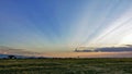 Beautiful sunset in Kenya. The sun`s rays painted the sky like a fan in shades of orange. Royalty Free Stock Photo