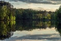 Beautiful sunset on the lake with a reflection on the water surface. Royalty Free Stock Photo