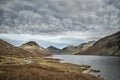 Beautiful sunset landscape image of Wast Water and mountains in