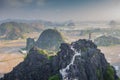 Beautiful sunset landscape viewpoint with white stupa from the top of Mua Cave mountain, Ninh Binh, Tam Coc, Vietnam.