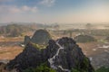 Beautiful sunset landscape viewpoint with white stupa from the top of Mua Cave mountain, Ninh Binh, Tam Coc, Vietnam.