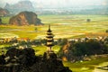 Beautiful sunset landscape viewpoint with white stupa from the top of Mua Cave mountain, Ninh Binh, Tam Coc, Vietnam