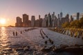 Beautiful Sunset and Lower Manhattan skyline with East River and New York City. Twilight with Reflections