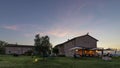 Beautiful sunset on luxury Tuscan resort with outdoor restaurant, Pontedera, Pisa, Tuscany, Italy