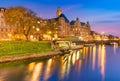 Beautiful sunset in Malmo, Sweden. Picturesque evening cityscape. Old historical buildings, canal with boats Royalty Free Stock Photo