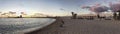 Beautiful sunset at marina in Rome, landscape of the beach and the entrance of the harbor with skyline of sailboats and buildings