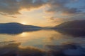 Beautiful sunset with mirror reflection on the water. Montenegro Royalty Free Stock Photo