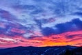 Beautiful sunset in a mountain landscape, glowing sky. Royalty Free Stock Photo