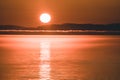 Beautiful Sunset with mountains and icebergs. Arctic circle and ocean. Sunrise horizon with pink sky during midnight sun