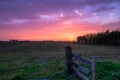 Beautiful sunset with a multi coloured sky over a Dutch agricultural polder landscape Royalty Free Stock Photo