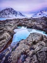 Beautiful sunset Norway landscape of picturesque stones on the arctic beach of cold Norwegian Sea Royalty Free Stock Photo