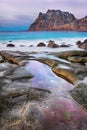 Beautiful sunset Norway landscape of picturesque stones on the arctic beach of cold Norwegian Sea Royalty Free Stock Photo