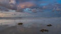 A beautiful sunset on the ocean shore. Reflection on wet sand. Royalty Free Stock Photo