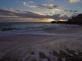 beautiful sunset ond the sand beach sea shore with sandstone cliffs and dramatic sky