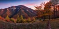 Beautiful sunset over autumn forest with big mountain panorama landscape in Slovakia Royalty Free Stock Photo