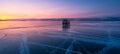 Beautiful sunset over Baikal frozen lake in winter season,  Olkhon island, Siberia,Russia. Panoramic banner portion Royalty Free Stock Photo